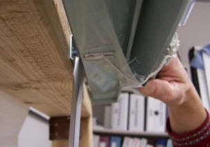 Supporting the headrail until brackets release.jpg