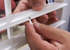 Insert the long side of the “T” of the new connector into the shutter stile.jpg