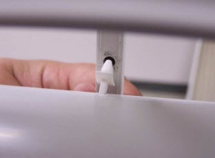 From the back of the panel, align the cufflink with the proper tilt bar hole.jpg